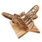 Wooden bee book stand on a white background