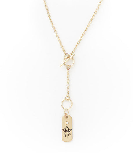 Gold necklace with a tag pendant on a white background