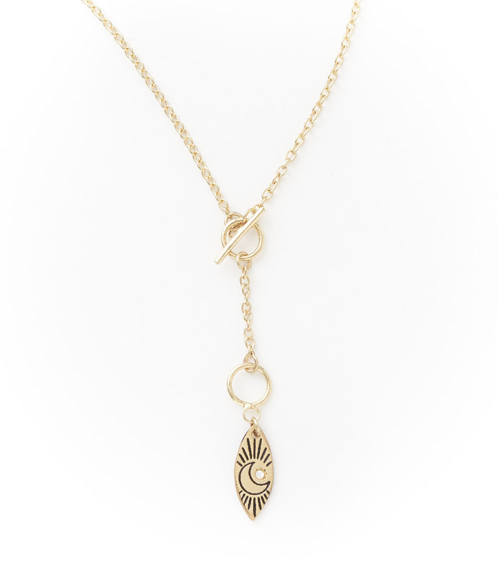 Gold necklace with a pendant on a white background