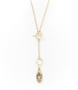 Gold necklace with a teardrop-shaped pendant on a white background