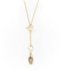Gold necklace with a teardrop-shaped pendant on a white background