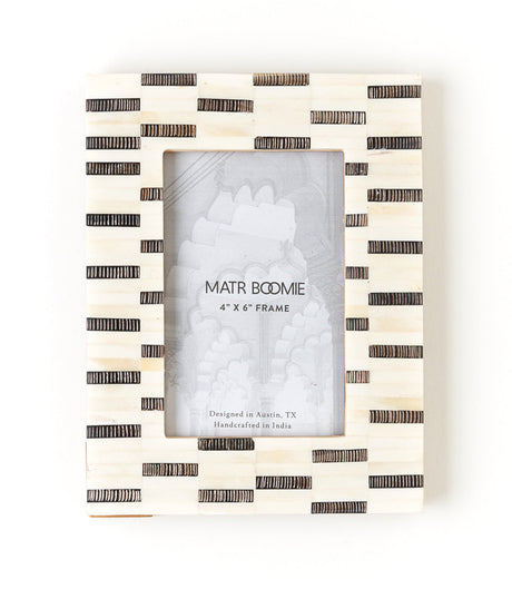 Black and white striped photo frame with 'MATR BOOMIE' branding on a white background