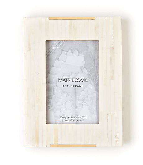 Wooden photo frame with 'MATR BOOMIE' branding on a white background