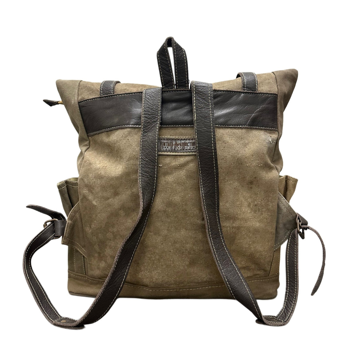 Brown leather backpack with black straps on a white background