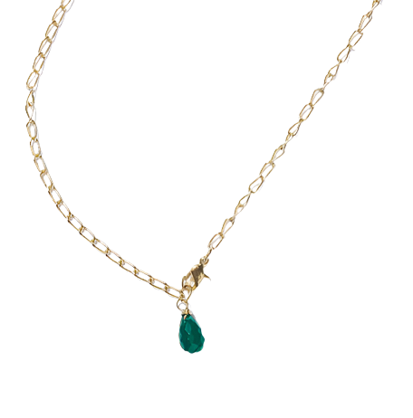 Gold necklace with a green teardrop pendant on a white background
