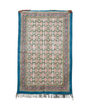 Decorative rug with floral pattern on a white background
