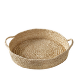 Woven basket with handles on a white background