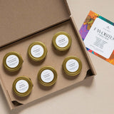 Set of small jars with gold lids in a cardboard box, with a card on the side. 2oz Mini Tins 6 Count