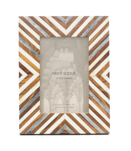 Wooden picture frame with geometric pattern on a white background