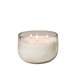 Glass candle holder with a lit candle on a white background