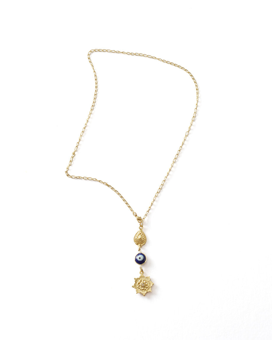 Gold necklace with decorative elements on a white background