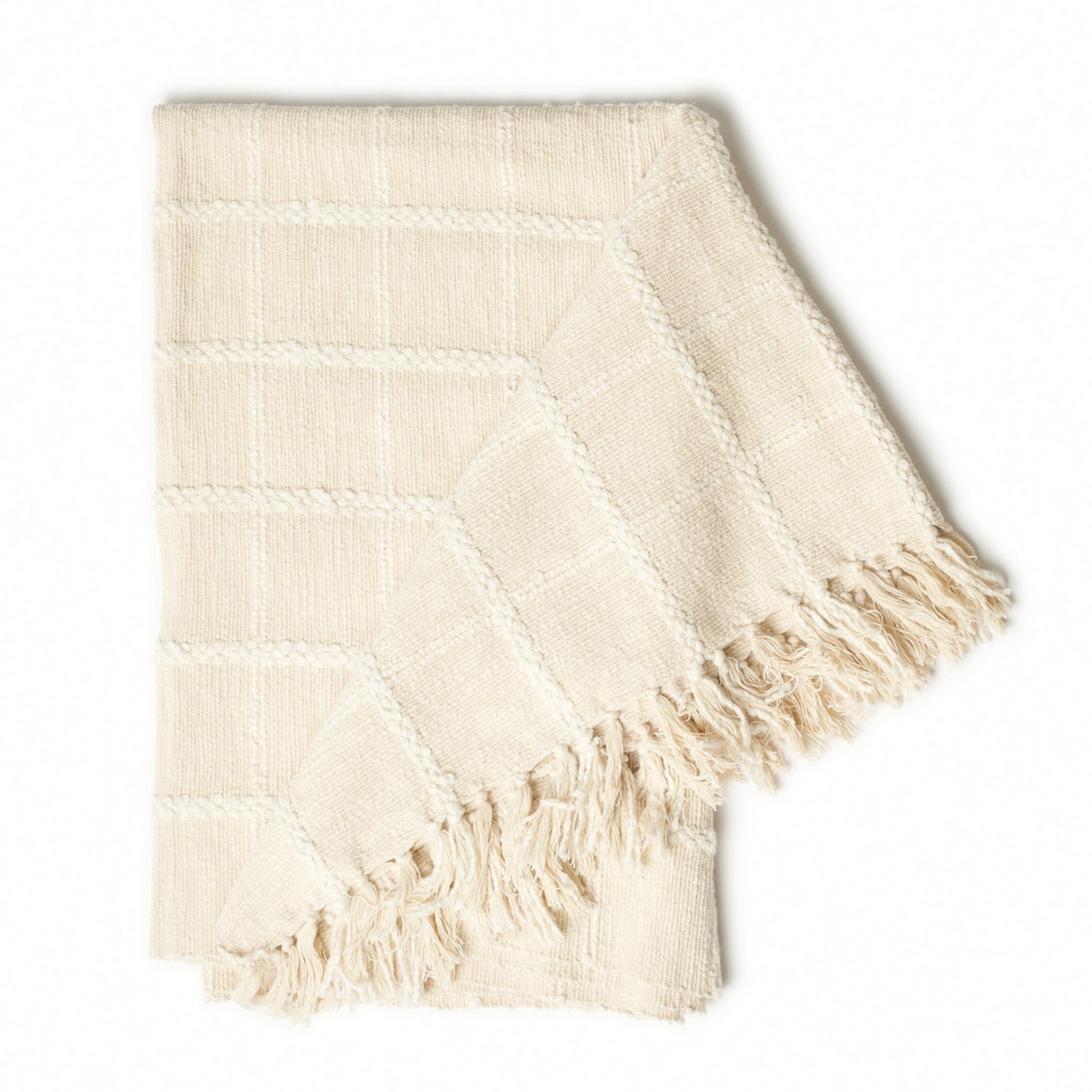 Beige woven blanket with fringes on a white background