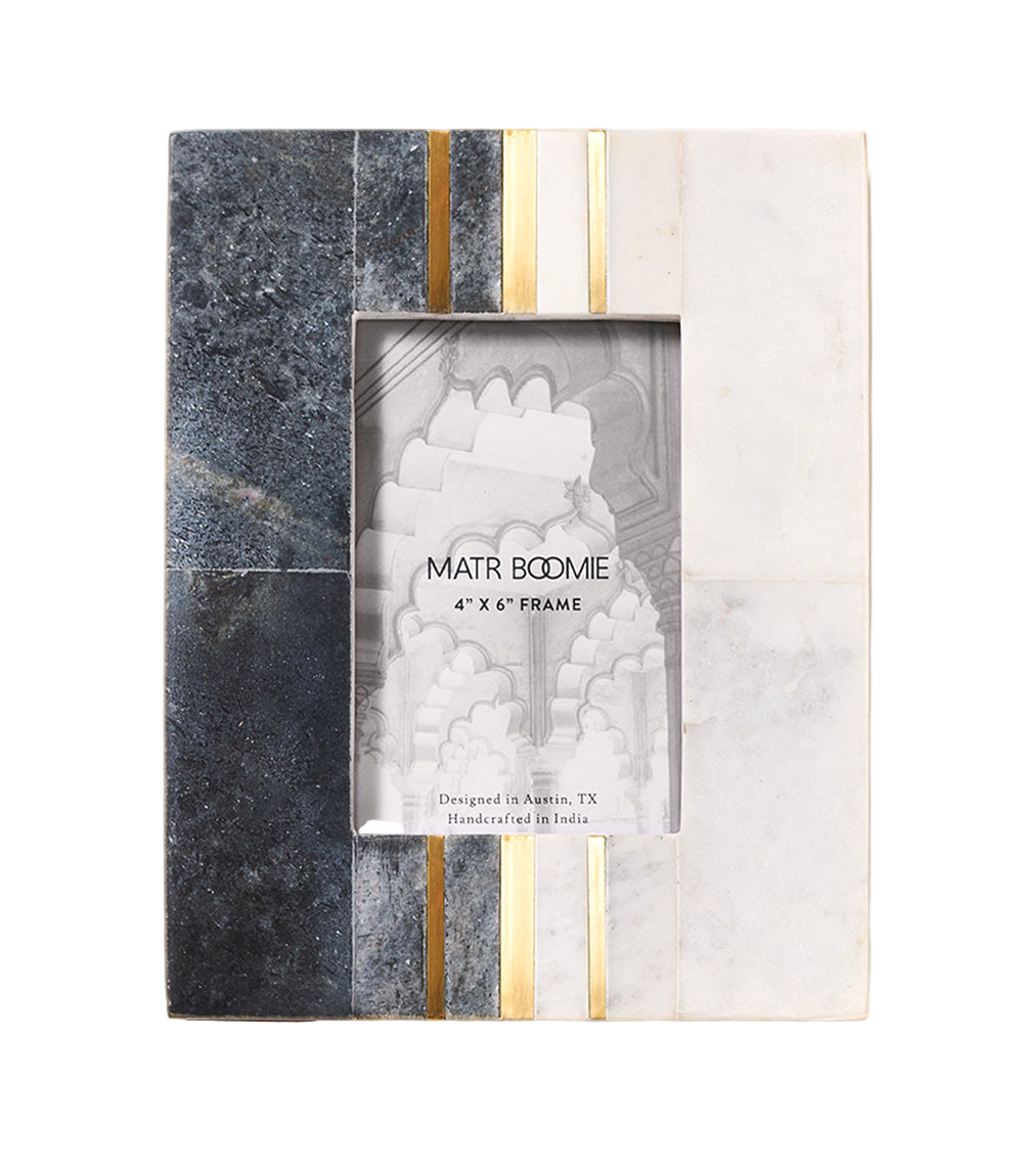 Marble-patterned photo frame with gold accents on a white background