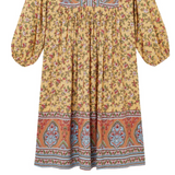 Yellow floral dress with patterned hem on a white background