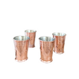 Four copper tumblers on a white background