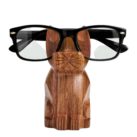 Wooden cat-shaped glasses holder with black-framed glasses on a white background