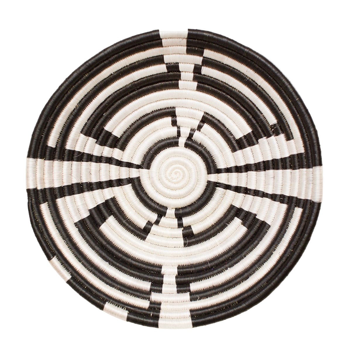 Round woven basket with black and white spiral pattern on a light beige background