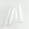 Two clear glass tumblers on a white background