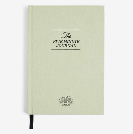 Light green journal with 'The Five Minute Journal' text on a white background