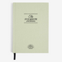 Light green journal with 'The Five Minute Journal' text on a white background