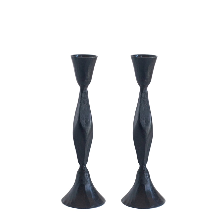 Two black twisted candle holders on a white background
