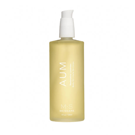 A yellow bottle with a white pump labeled 'AUM' from AUM Skincare, containing a lavender body oil.