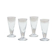 Four clear glass tumblers on a white background