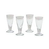 Four clear glass tumblers on a white background