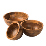 Three wooden bowls of different sizes on a white background