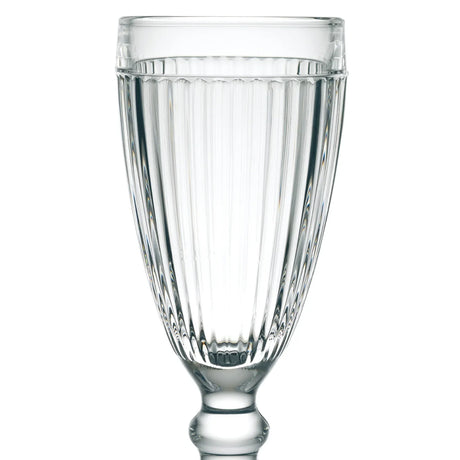 A clear, ribbed glass goblet from the La Rochere Antillaise Ice Cream Cup Set of 6, with a classic design reminiscent of timeless cups, filled with water.