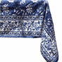Table set with a blue and white patterned tablecloth on a white background