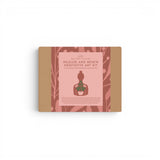 Meditative art kit packaging with a silhouette of a person and nature elements on a white background