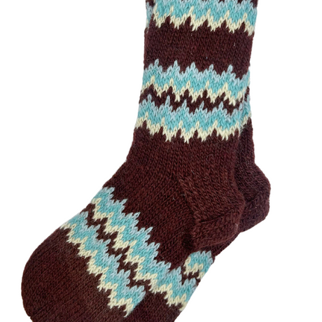 Knitted sock with brown, blue, and white pattern on a white background