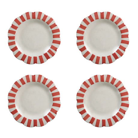 Four ceramic plates with red and white striped rims on a white background