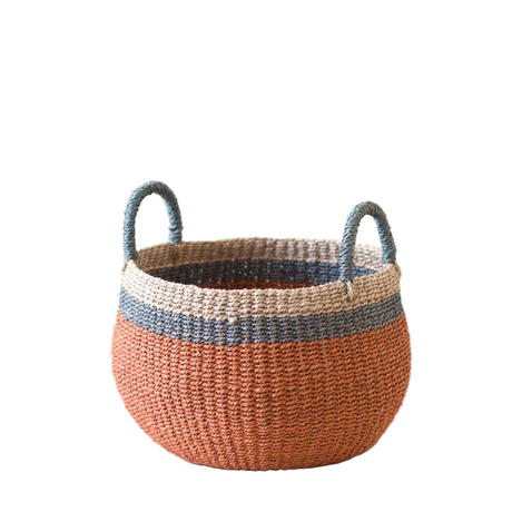 Woven basket with two-tone design on a white background