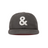 Gray cap with a white ampersand symbol on a white background