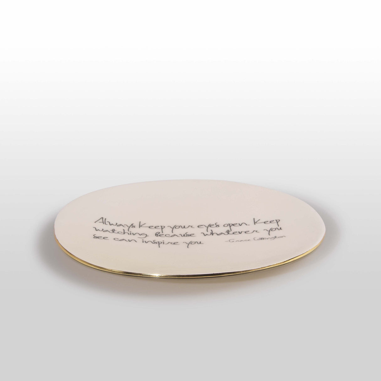 Round ceramic plate with text on a white background
