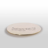 Round ceramic plate with text on a white background