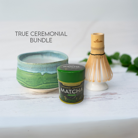 The "True Ceremonial Bundle" showcases the exquisite Iguchi Deep Sea Clay Matcha Bowl, a matcha tin, and a bamboo whisk on a pristine white surface.