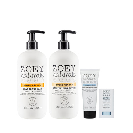 Zoey Naturals skincare products including a face wash, lotion, and sunscreen on a white background.