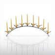 Decorative candle holder with gold birds and candles on a white background