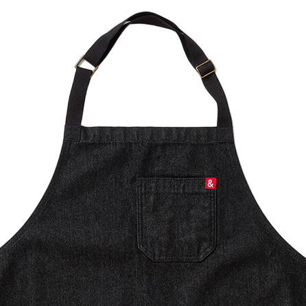 Black apron with a red label on a white background