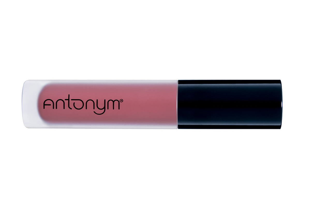 Lip gloss with black cap and visible brand name on a white background