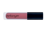 Lip gloss with black cap and visible brand name on a white background
