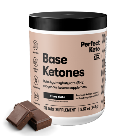 Perfect Keto Base Ketones container with chocolate pieces on a white background