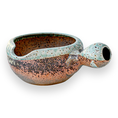 The Brown Ceramic Matcha Bowl with Spout features a multicolored speckled glaze on a black background, making it perfect for matcha and a unique housewarming gift for those who appreciate Japanese tea ceremonies.