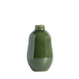Green ceramic vase on a white background
