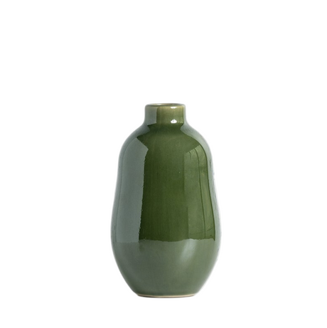 Green ceramic vase on a white background