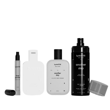 Set of laundry care products with 'byMATER' branding on a white background