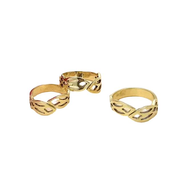 Three gold rings with openwork design on a white background